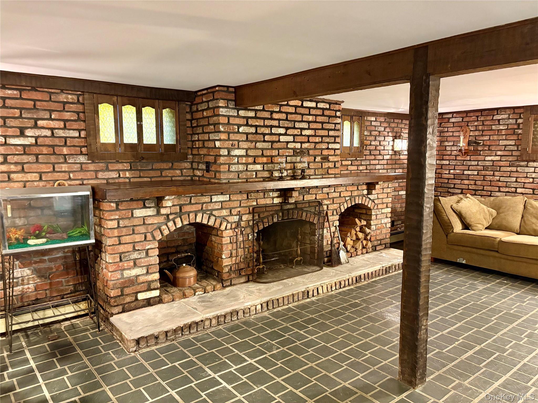 223 Timber Point Road East Islip, NY 11730 - Photo 34 of 47 a view of a fireplace and a couch in a balcony
