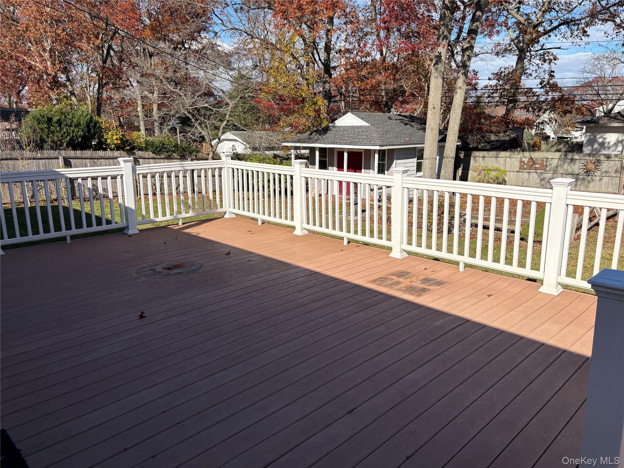 223 Timber Point Road East Islip, NY 11730 - Photo 39 of 47 a porch with wooden floor