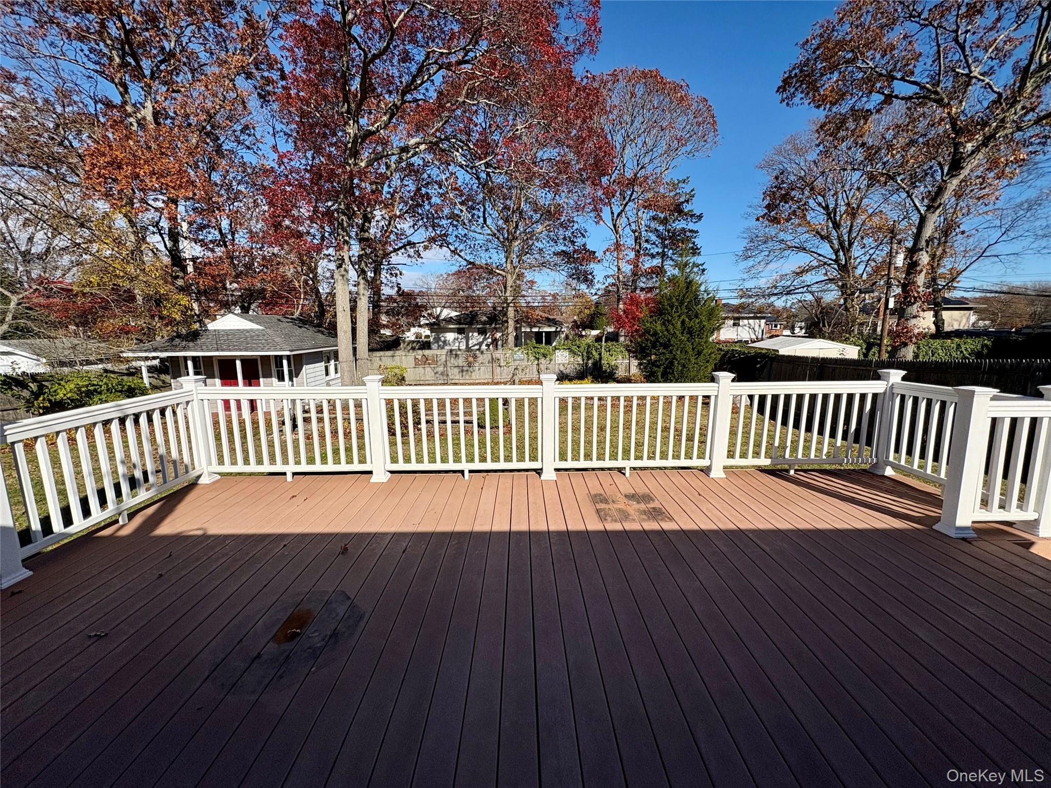 223 Timber Point Road East Islip, NY 11730 - Photo 41 of 47 a view of deck with a large window and wooden floor