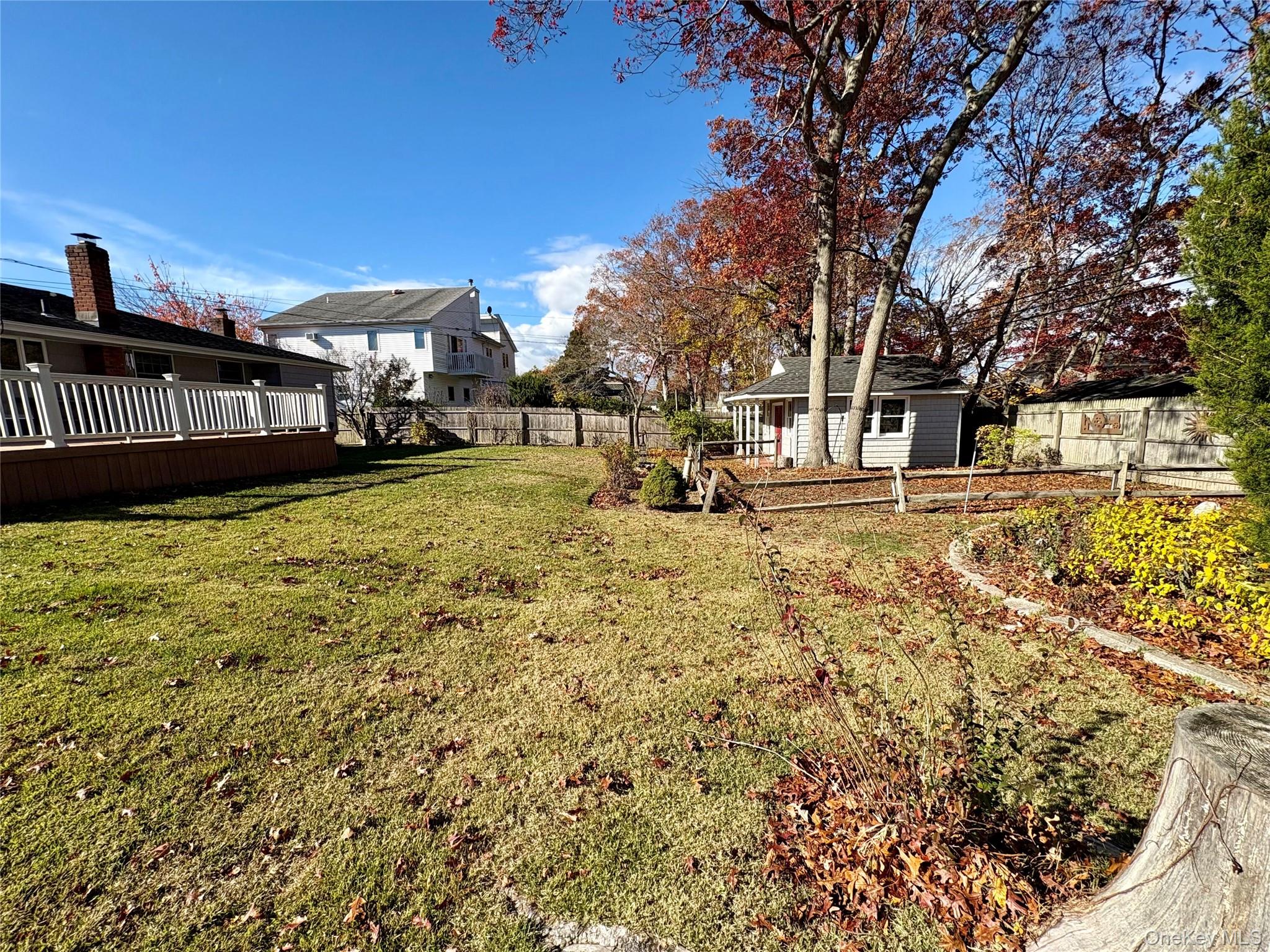223 Timber Point Road East Islip, NY 11730 - Photo 45 of 47 a view of a yard with wooden fence