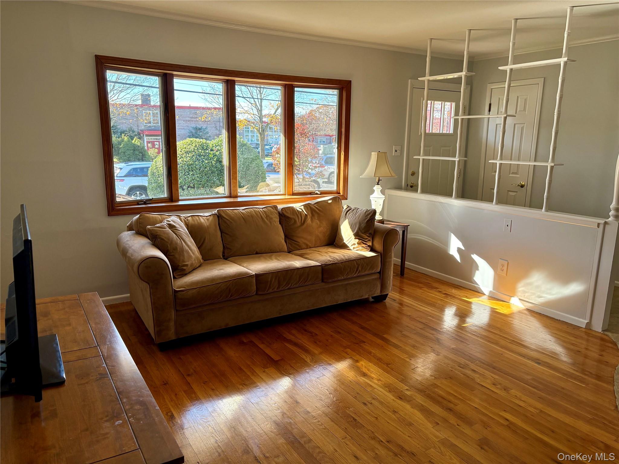 223 Timber Point Road East Islip, NY 11730 - Photo 5 of 47 a living room with furniture and a large window