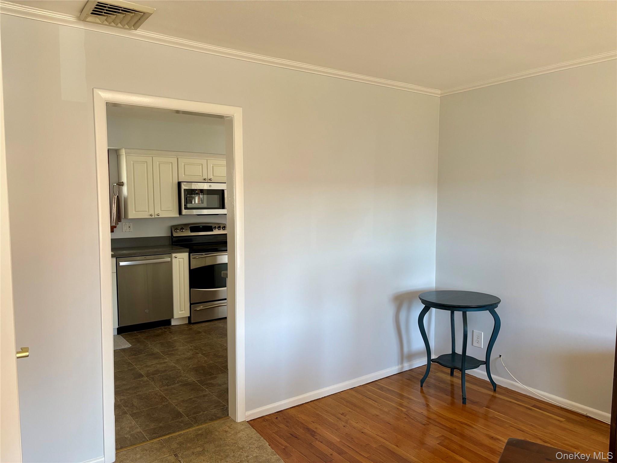223 Timber Point Road East Islip, NY 11730 - Photo 8 of 47 a view of a kitchen with wooden floor and a sink