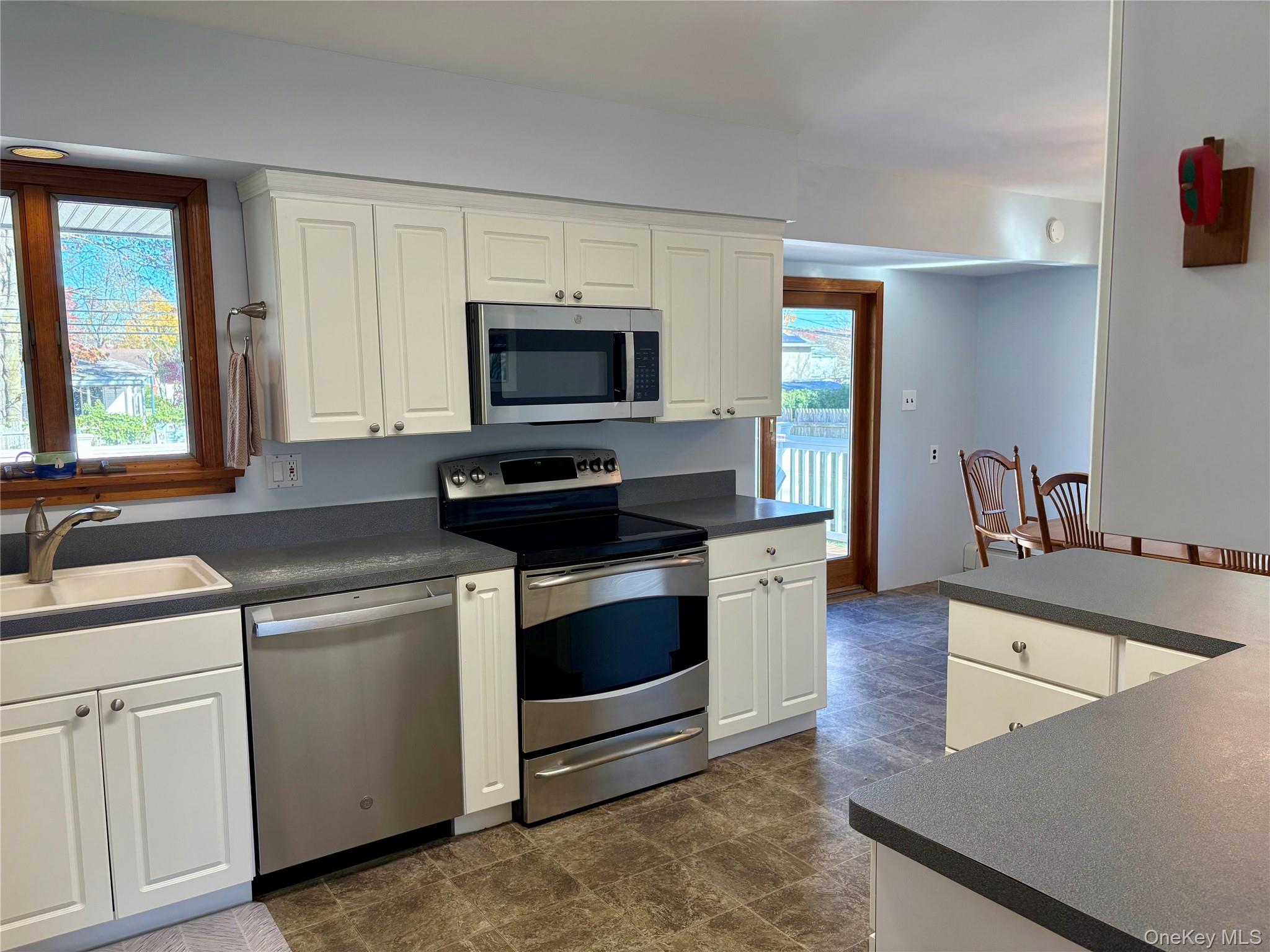 223 Timber Point Road East Islip, NY 11730 - Photo 10 of 47 a kitchen with a stove and a sink
