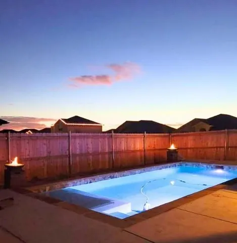 a view of a backyard with a barbeque
