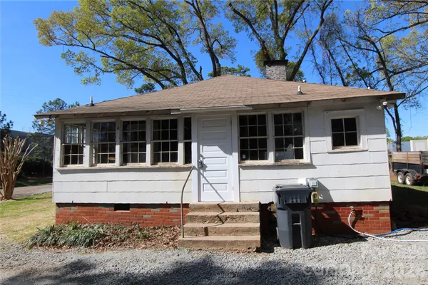 a view of house with a patio