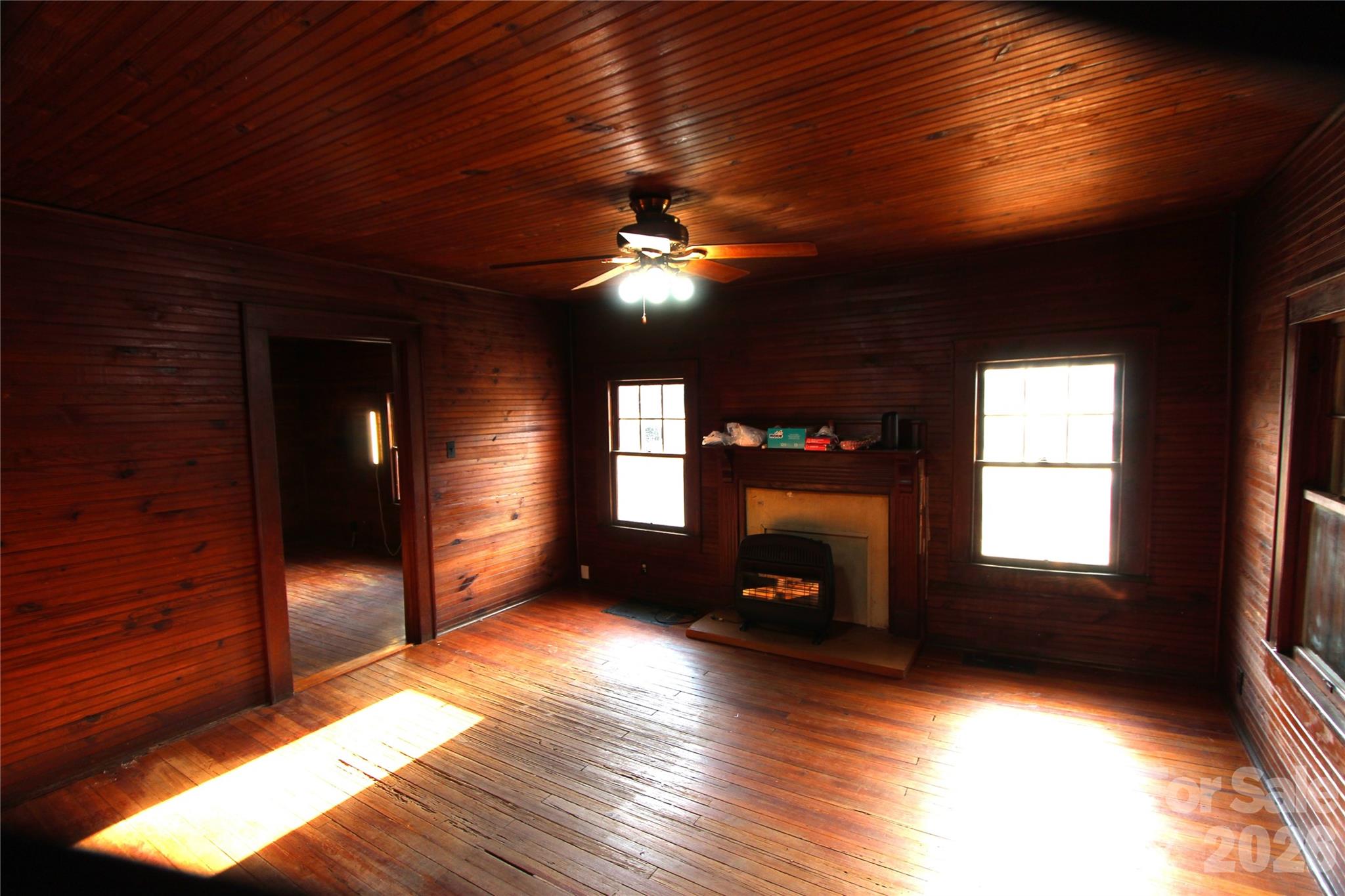 4912 Gable Road Charlotte, NC 28273 - Photo 4 of 10 a view of empty room with wooden floor and fan