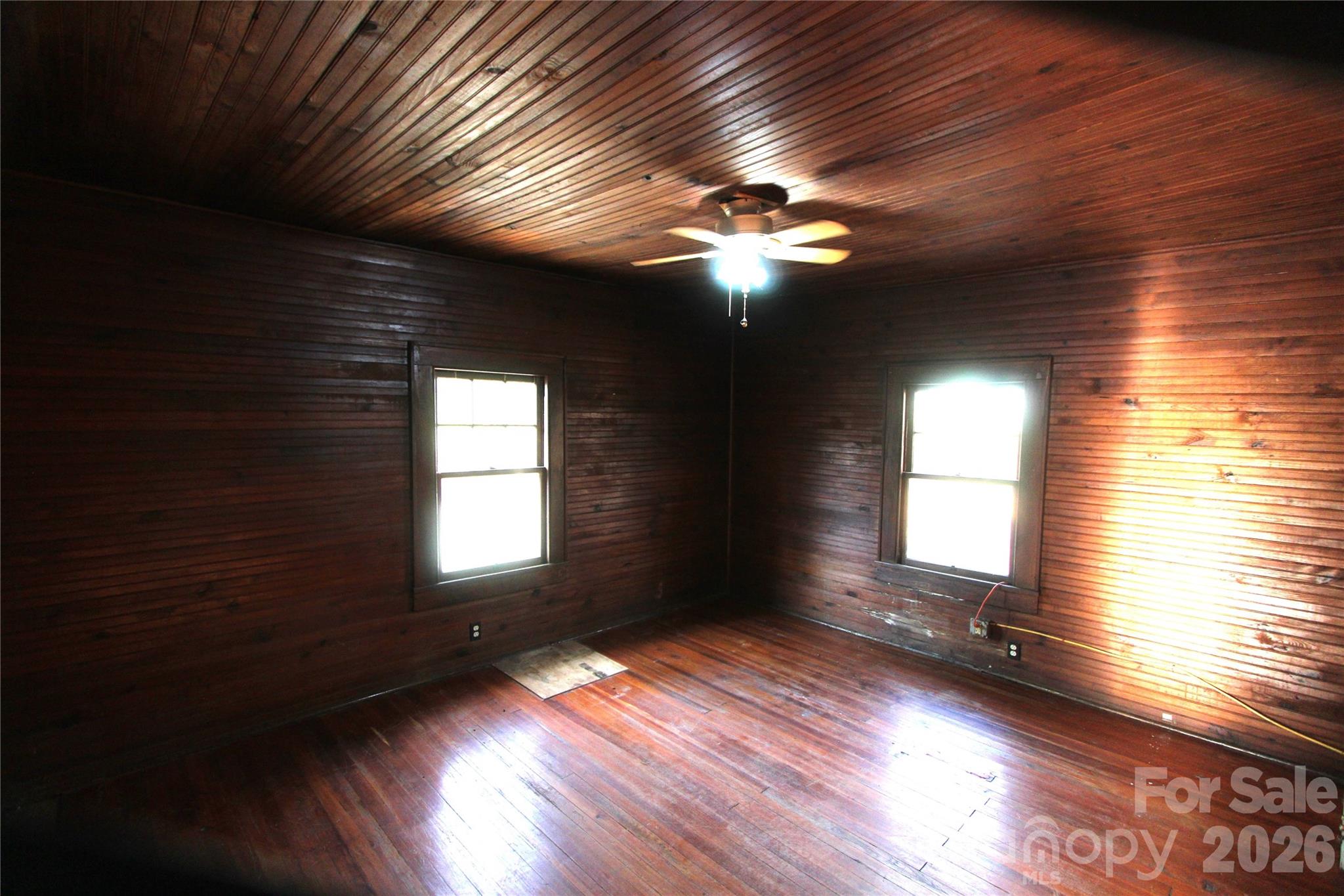 4912 Gable Road Charlotte, NC 28273 - Photo 6 of 10 a view of empty room with wooden floor and fan