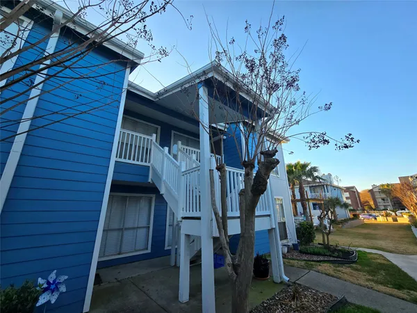 a view of a house with a tree