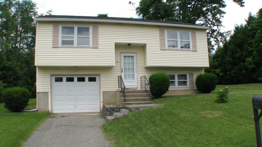 147 Concord Road Torrington, CT 06790 - Photo 1 of 1 a front view of a house with a garden