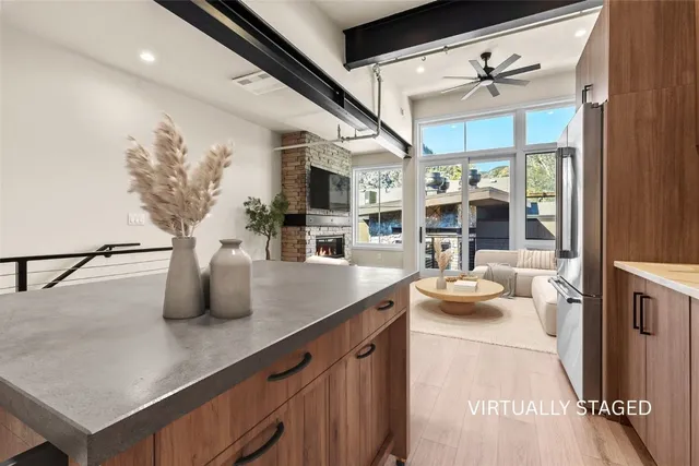 a kitchen with a sink appliances and a counter top space