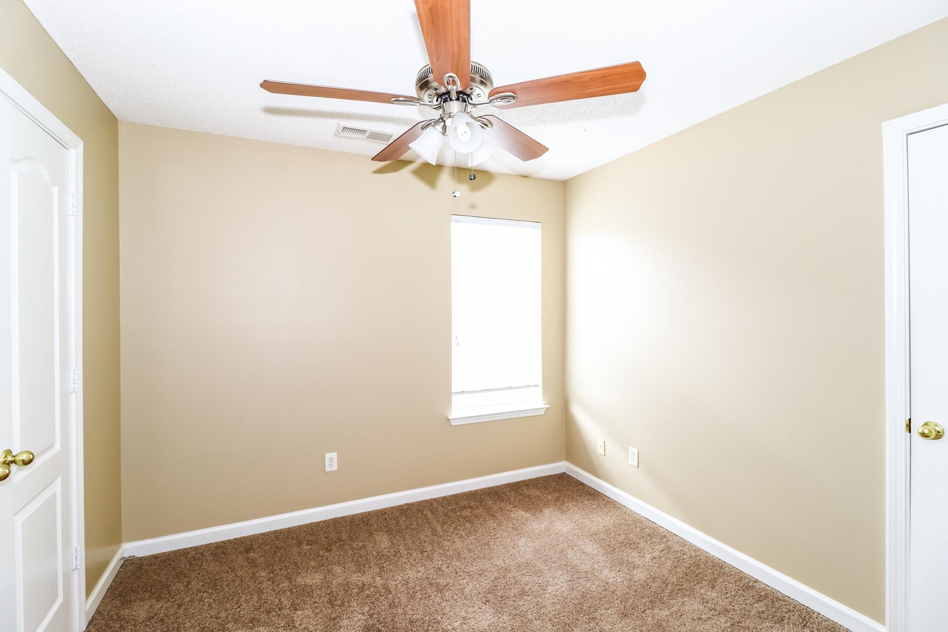 10097 Cross Ridge Road Cordova, TN 38018 - Photo 11 of 17 a view of a room with a ceiling fan and a window