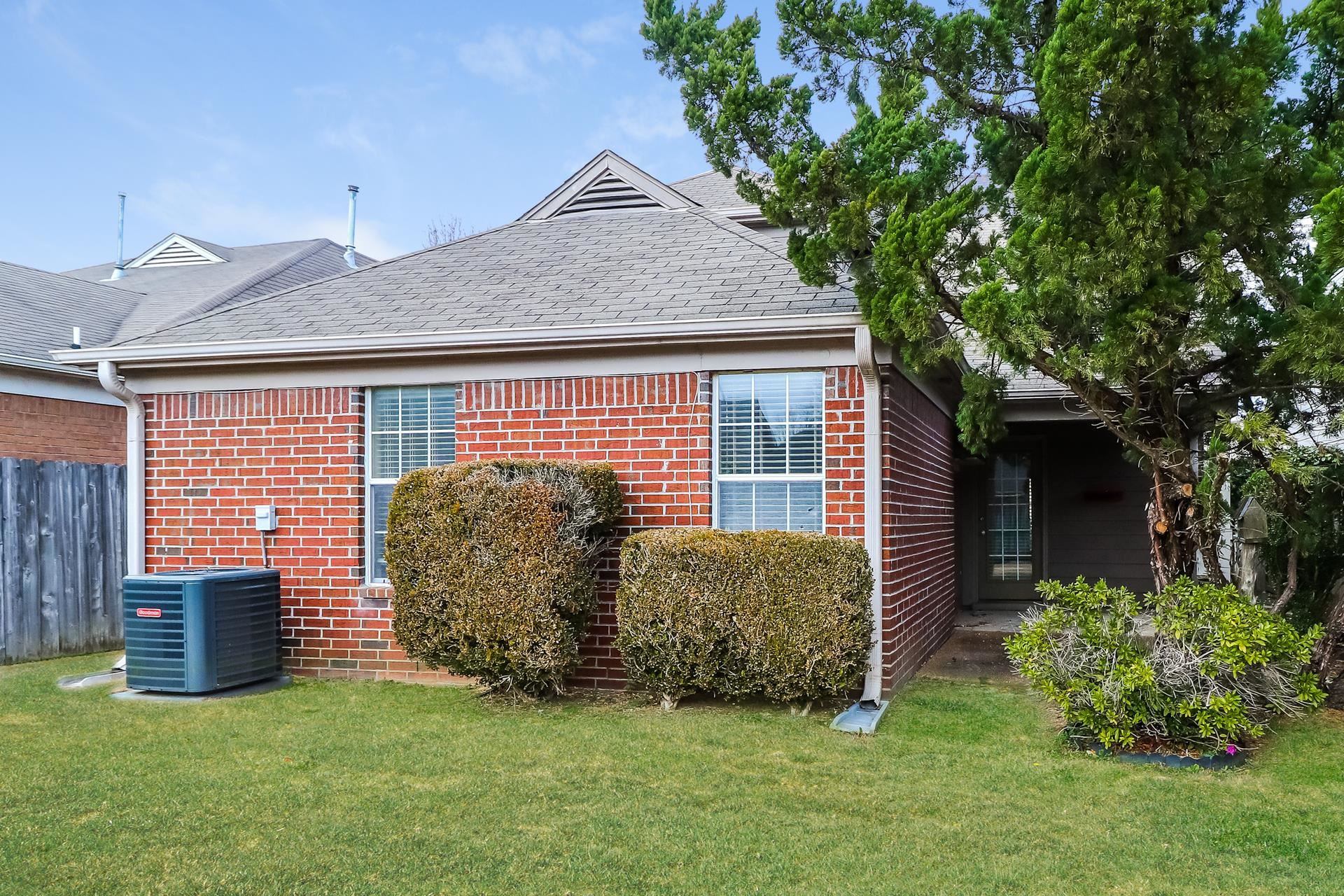 10097 Cross Ridge Road Cordova, TN 38018 - Photo 14 of 17 a front view of a house with garden
