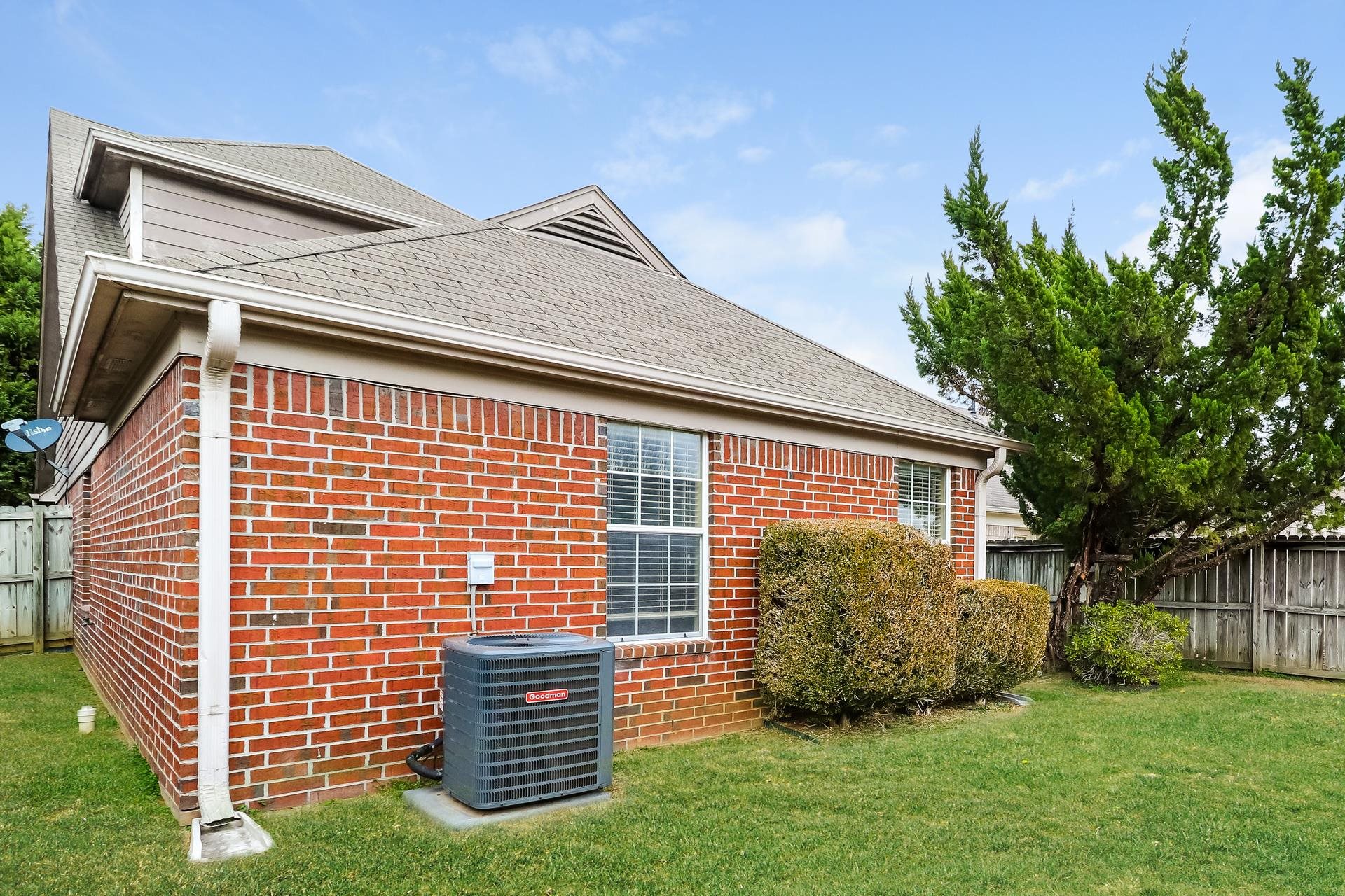 10097 Cross Ridge Road Cordova, TN 38018 - Photo 15 of 17 a front view of a house with a garden