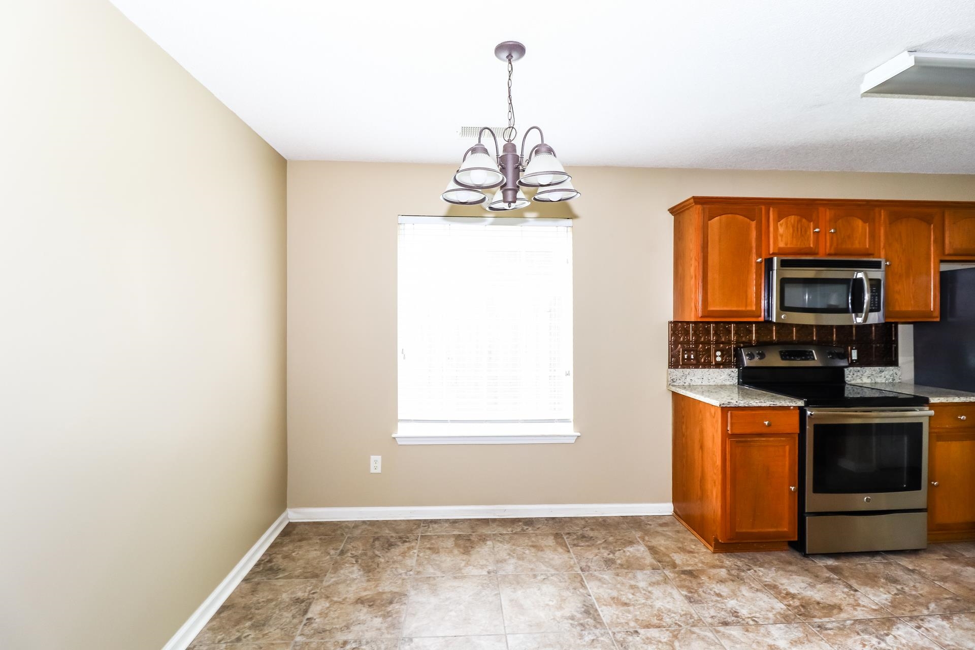 10097 Cross Ridge Road Cordova, TN 38018 - Photo 5 of 17 a view of a kitchen with a sink cabinet and a window