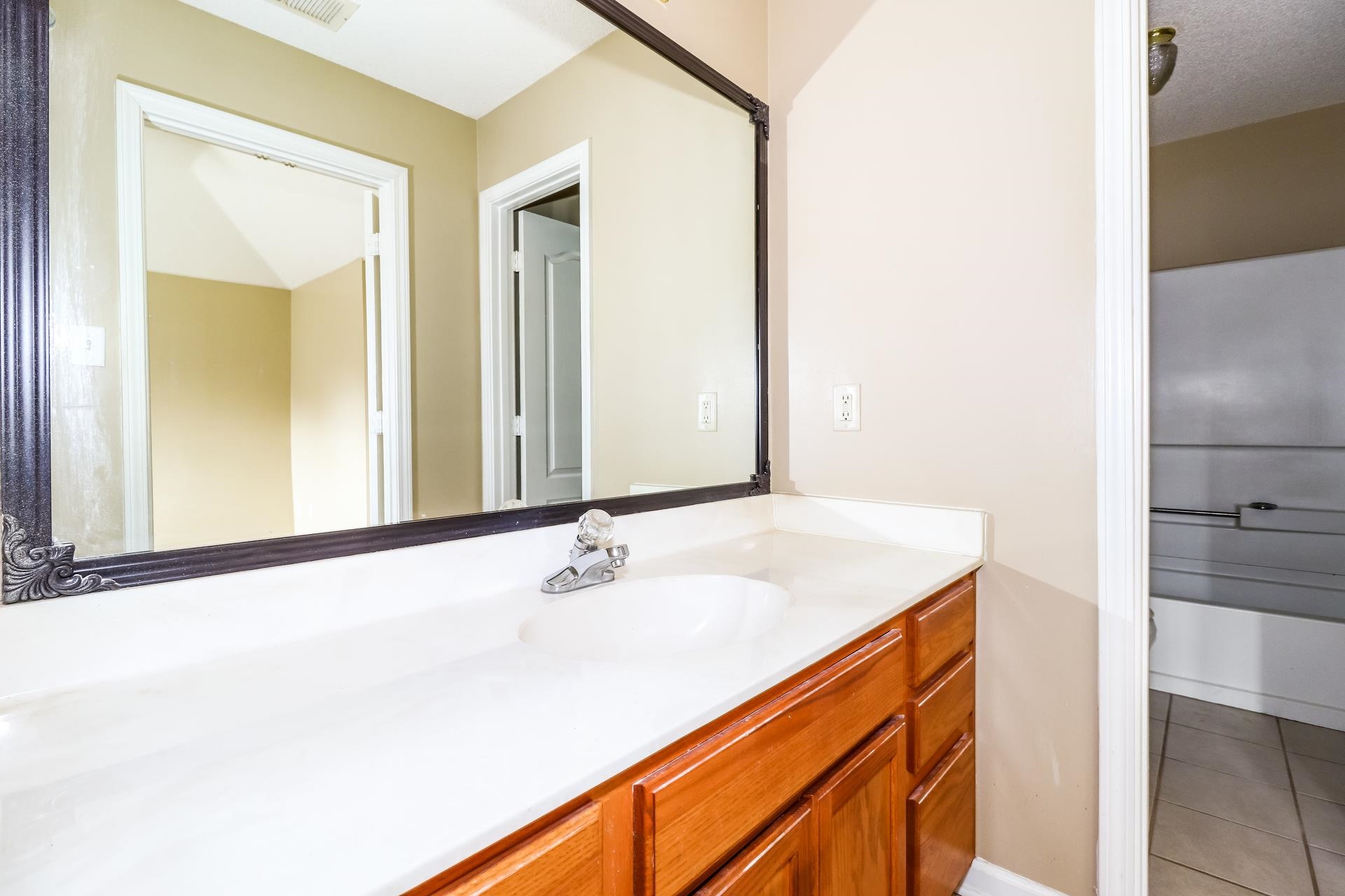 10097 Cross Ridge Road Cordova, TN 38018 - Photo 10 of 17 a bathroom with a sink and a mirror