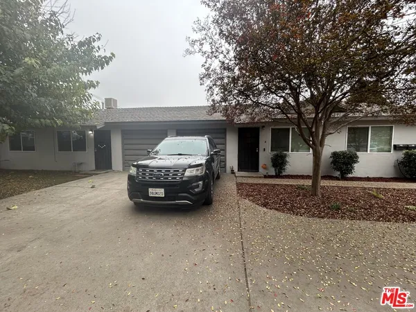 a car parked in front of a house