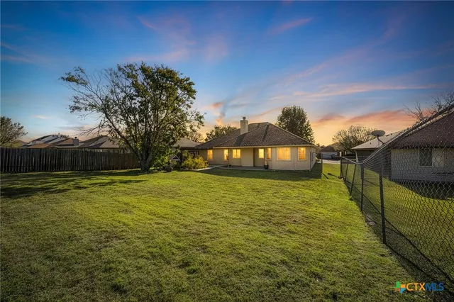 a view of swimming pool with an outdoor seating