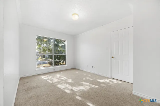 an empty room with windows