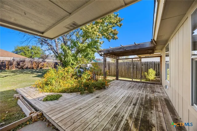 a yellow house with swimming pool in front of it