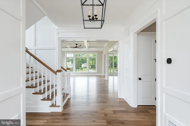 a view of an entryway with wooden floor