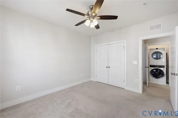 wooden floor and a chandelier fan in a room