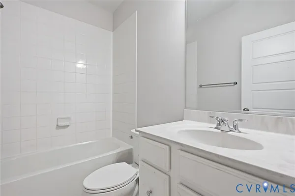 a bathroom with a sink toilet and bathtub