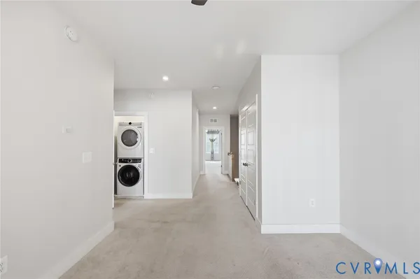 a view of a kitchen with a sink and a refrigerator