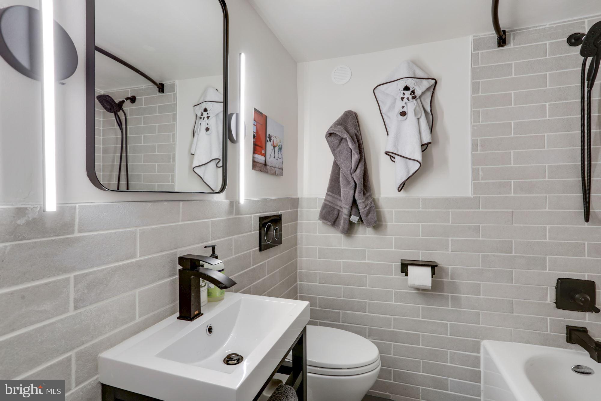 554 23rd Place Northeast Washington, DC 20002 - Photo 24 of 26 Basement bathroom is also newer and renovated