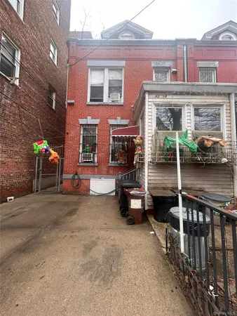 a view of a brick building with many windows