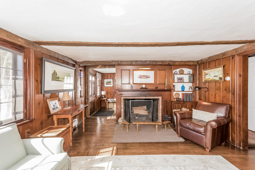342 Westport Road Wilton, CT 06897 - Photo 3 of 22 a living room with fireplace furniture and a floor to ceiling window