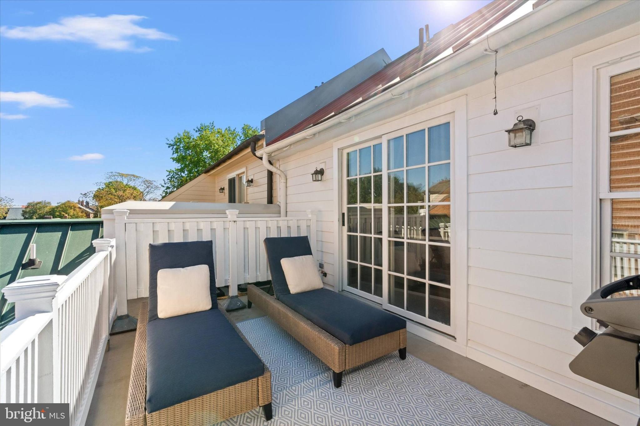 403 Princess Street Alexandria, VA 22314 - Photo 7 of 50 a view of roof deck with chair and wooden floor