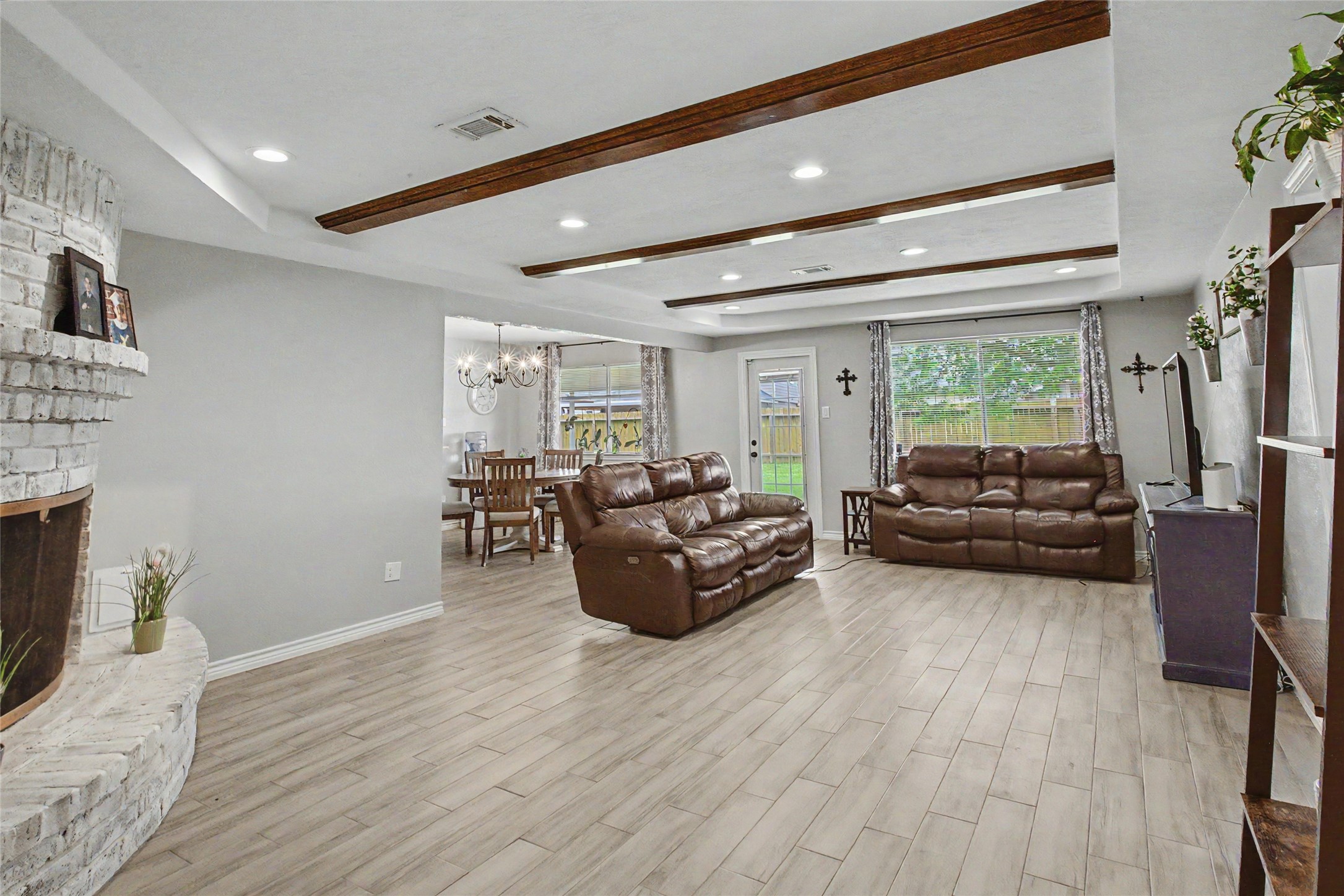 327 Fir Ridge Drive Huffman, TX 77336 - Photo 7 of 25 Accented with modern paint 2022 and warm wood beams.