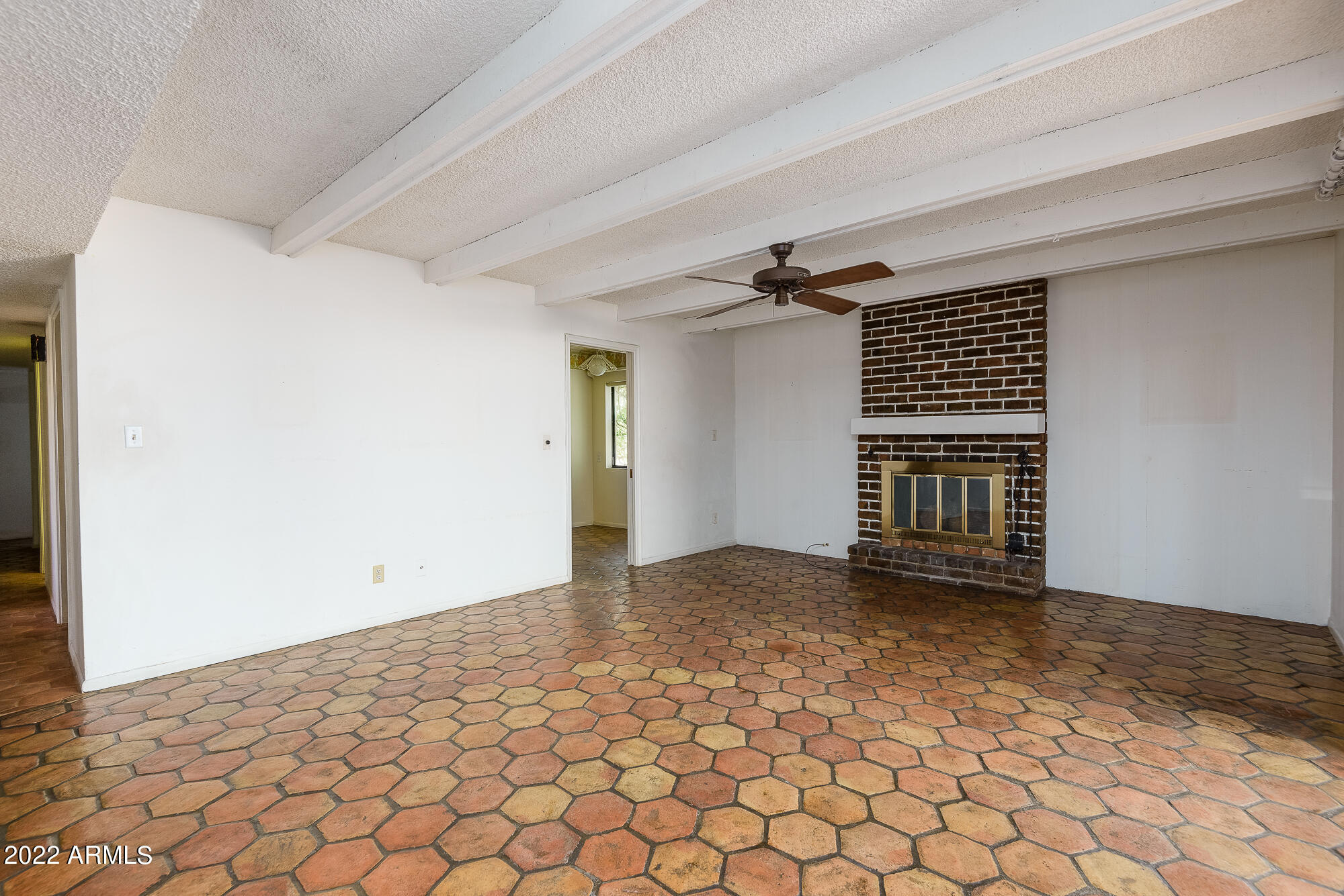 6016 North 10th Way Phoenix, AZ 85014 - Photo 12 of 28 Family room with kitchen on left