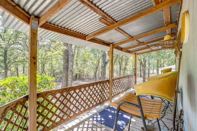a view of a two chairs in the balcony