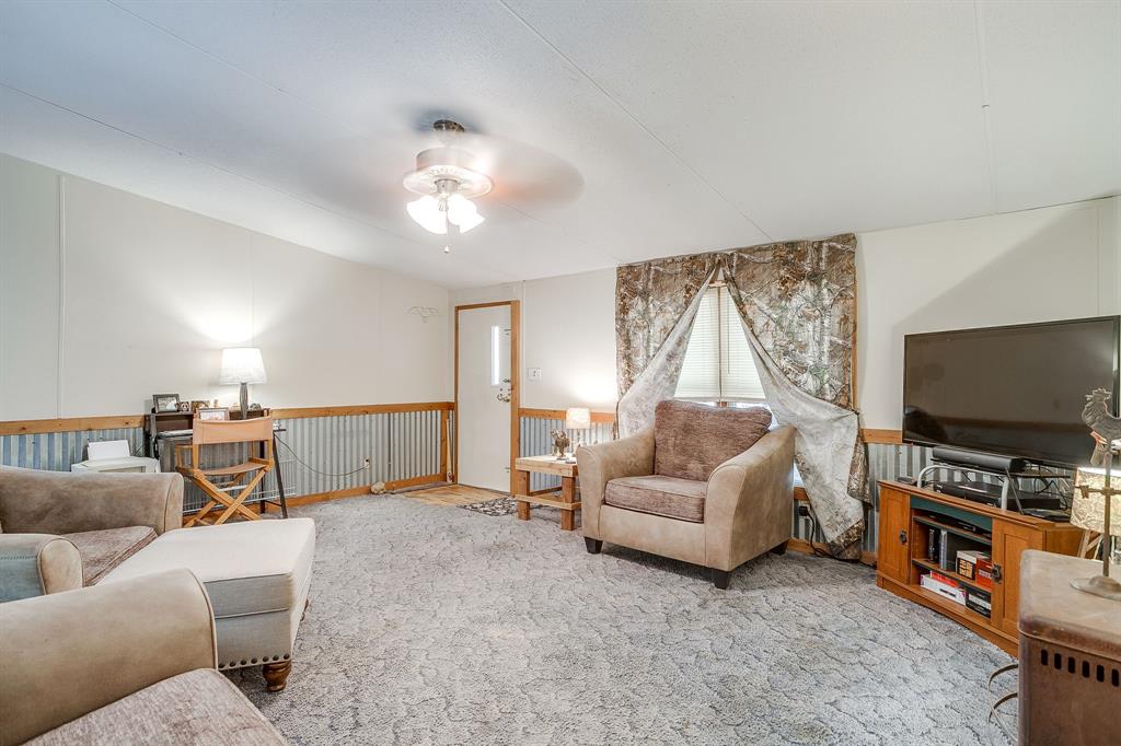 436 Luke Road Springtown, TX 76082 - Photo 15 of 39 a living room with furniture and a flat screen tv