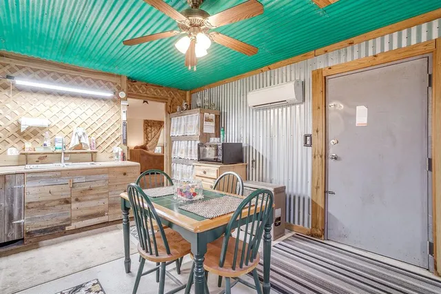 a kitchen with stainless steel appliances granite countertop a sink and a stove