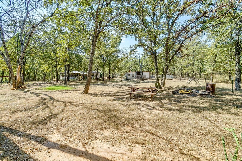 436 Luke Road Springtown, TX 76082 - Photo 29 of 39 a view of road with trees