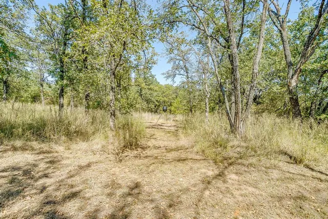 a house view with a sitting space and garden