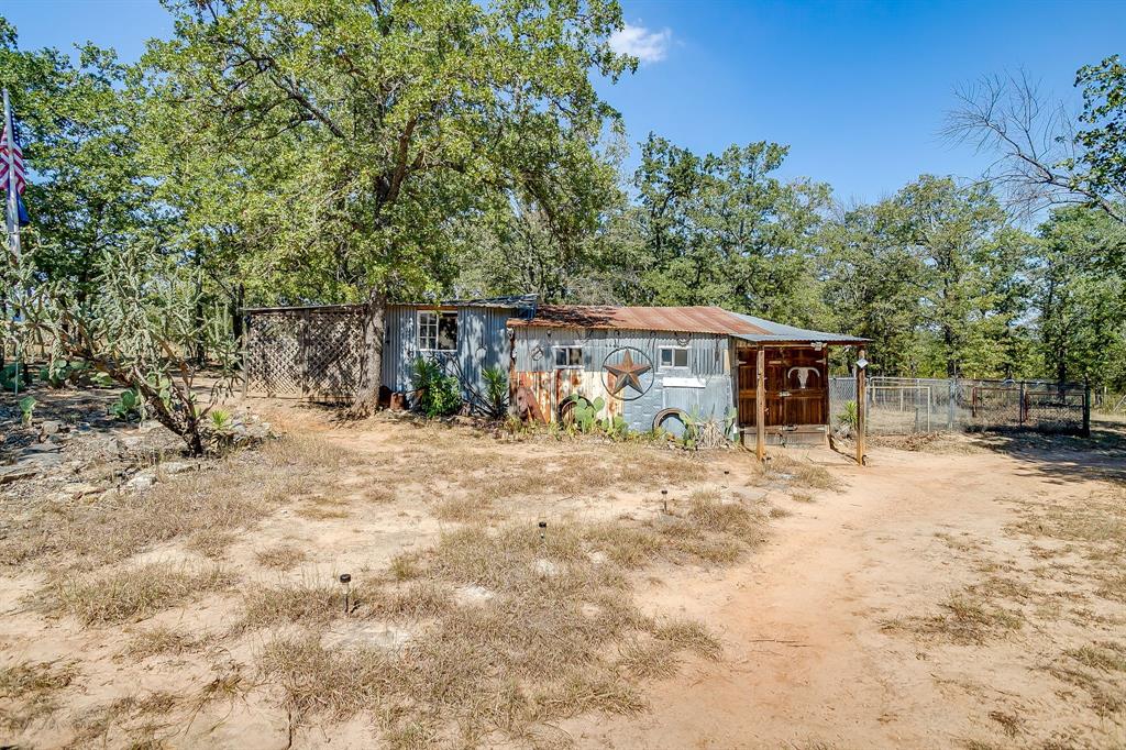 436 Luke Road Springtown, TX 76082 - Photo 33 of 39 a view of a house with a yard