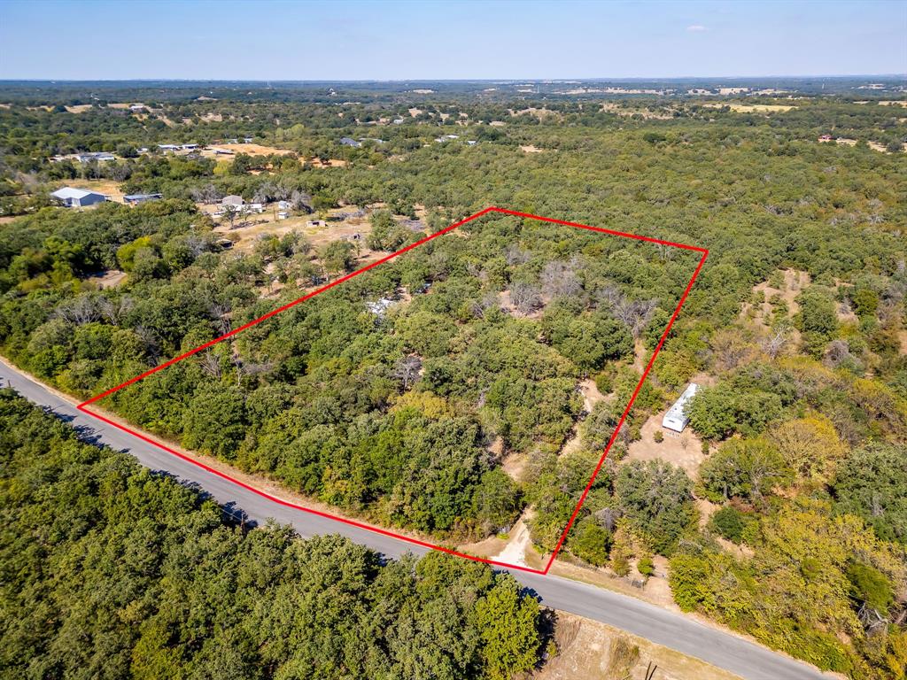 436 Luke Road Springtown, TX 76082 - Photo 36 of 39 a view of a green field with an outdoor space