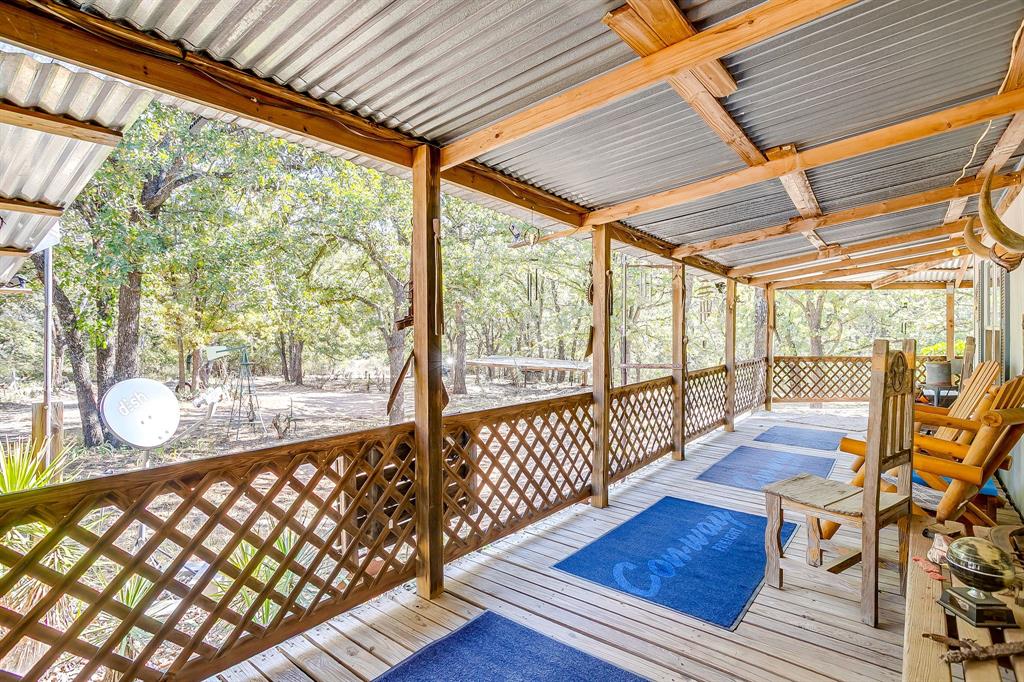 436 Luke Road Springtown, TX 76082 - Photo 9 of 39 a view of a porch with wooden floor
