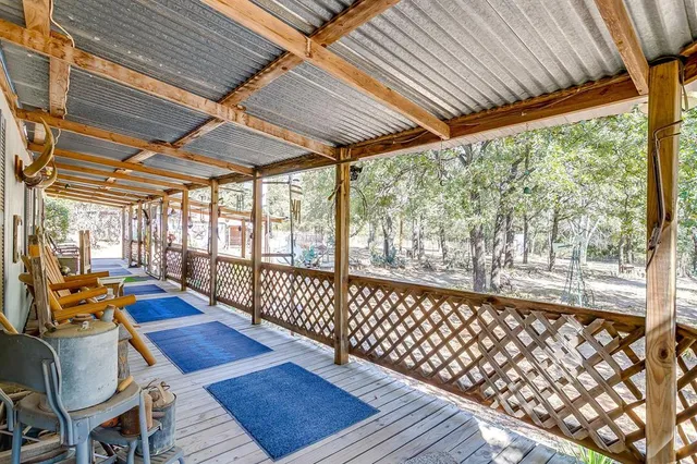 a living room with furniture on wooden floor