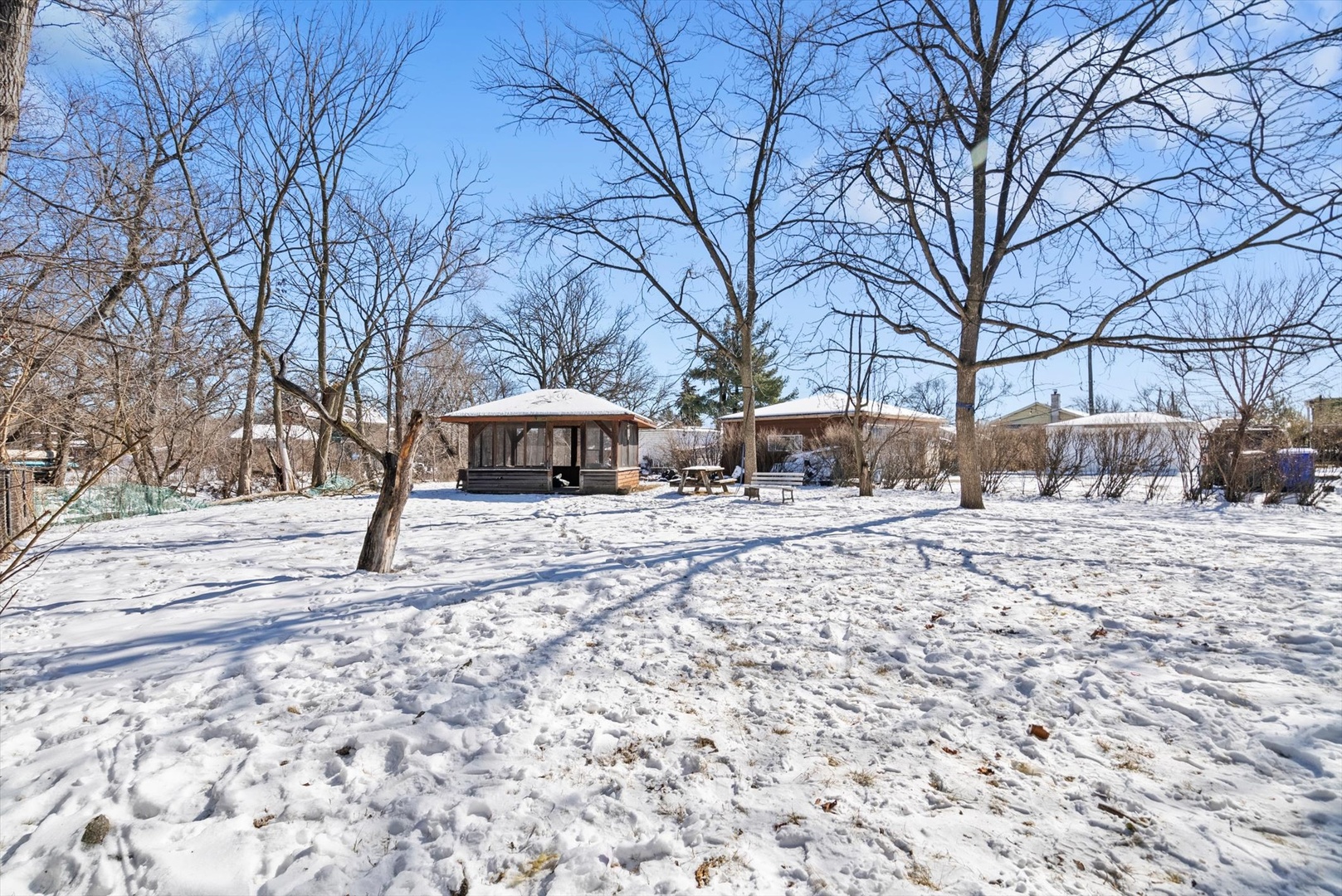 3907 Custer Avenue Lyons, IL 60534 - Photo 17 of 24 a front view of a house with a yard and covered with snow