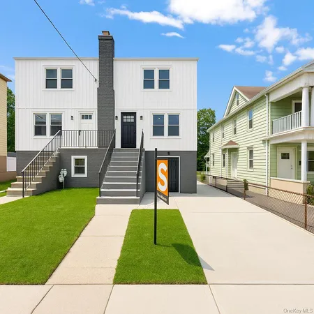a view of a house with a yard