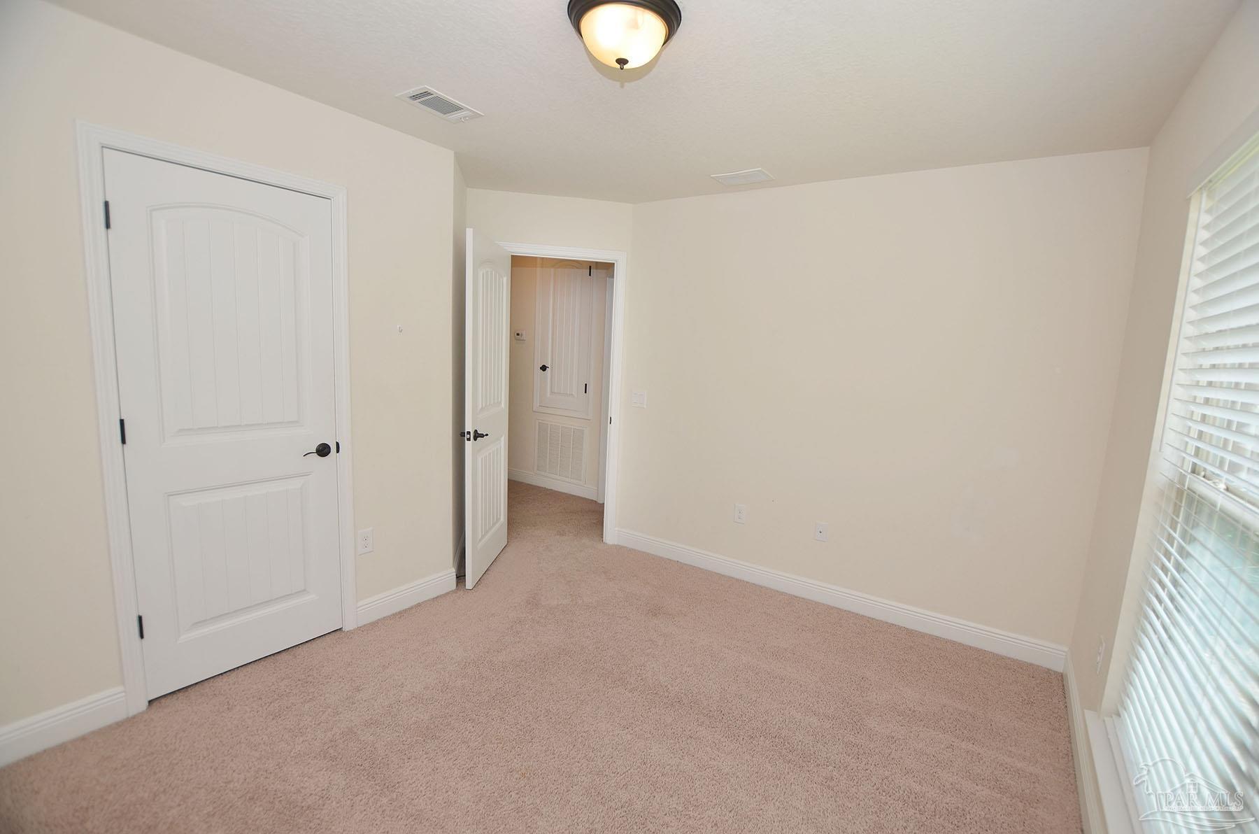5709 Mill Stream Way Pace, FL 32571 - Photo 41 of 48 a view of entryway with window