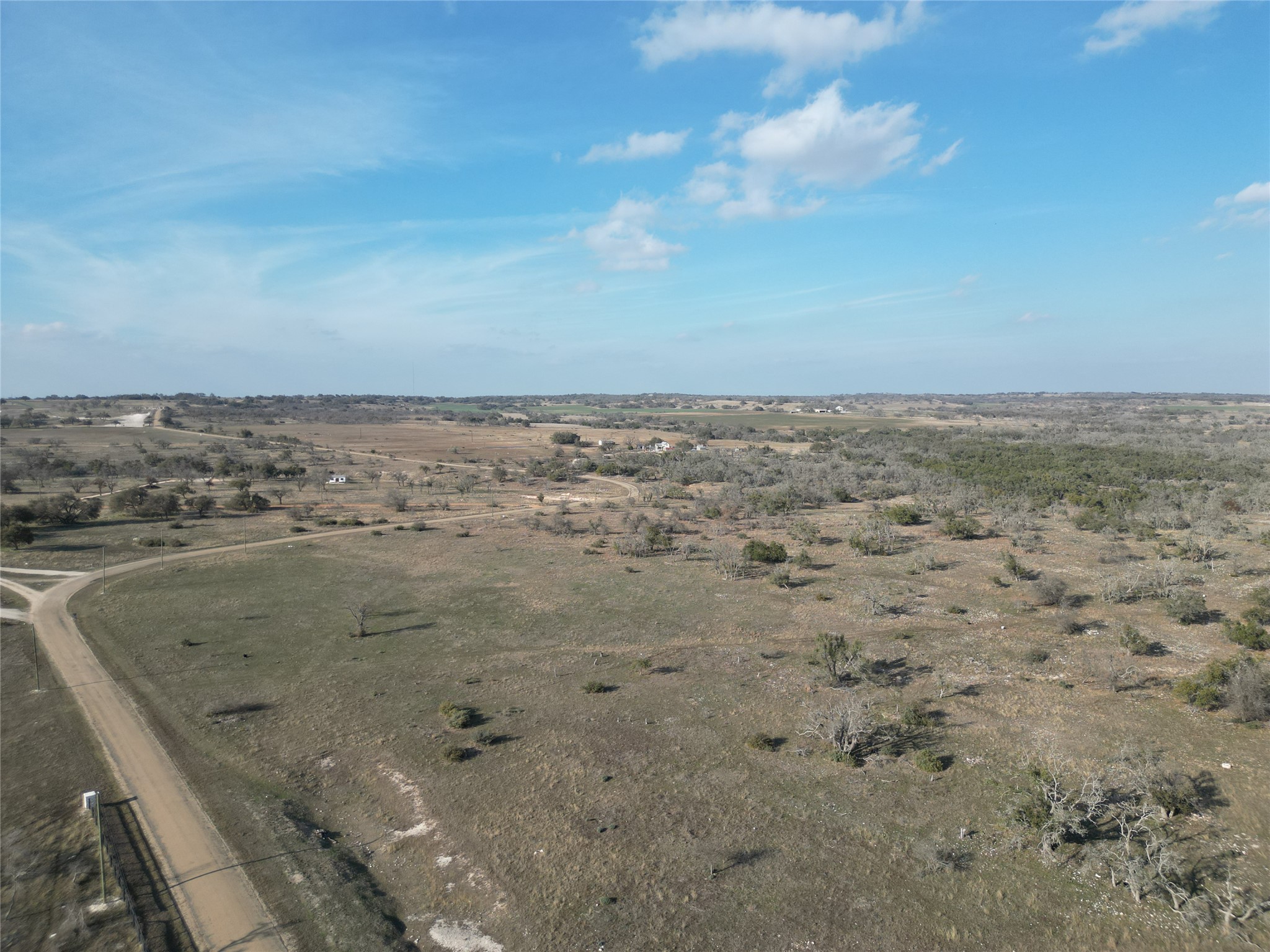51 Reeh Road Harper, TX 78631 - Photo 2 of 8 Aerial view of property and surrounding area featuring rural landscape