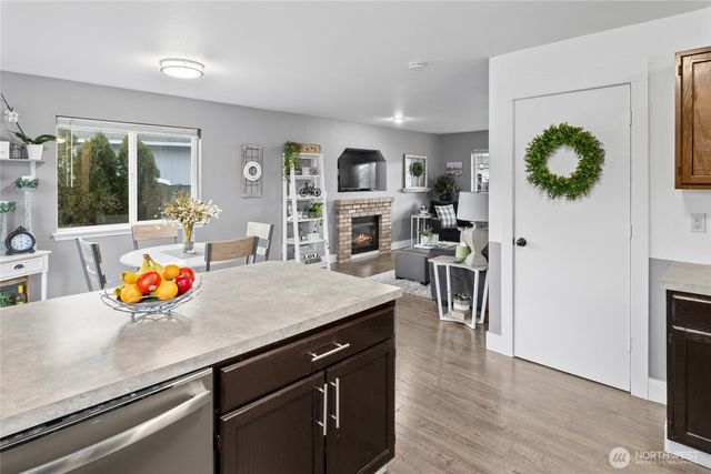 a kitchen with a counter space and a wooden floor
