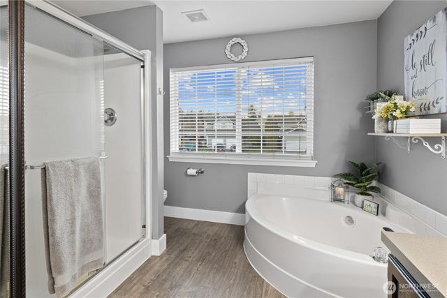 a white bath tub sitting next to a window