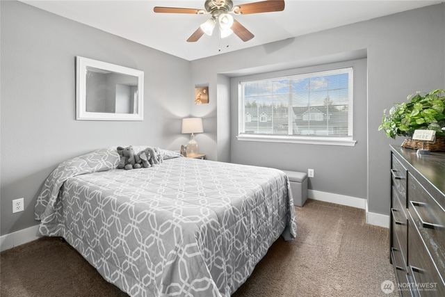 a bedroom with bed and window