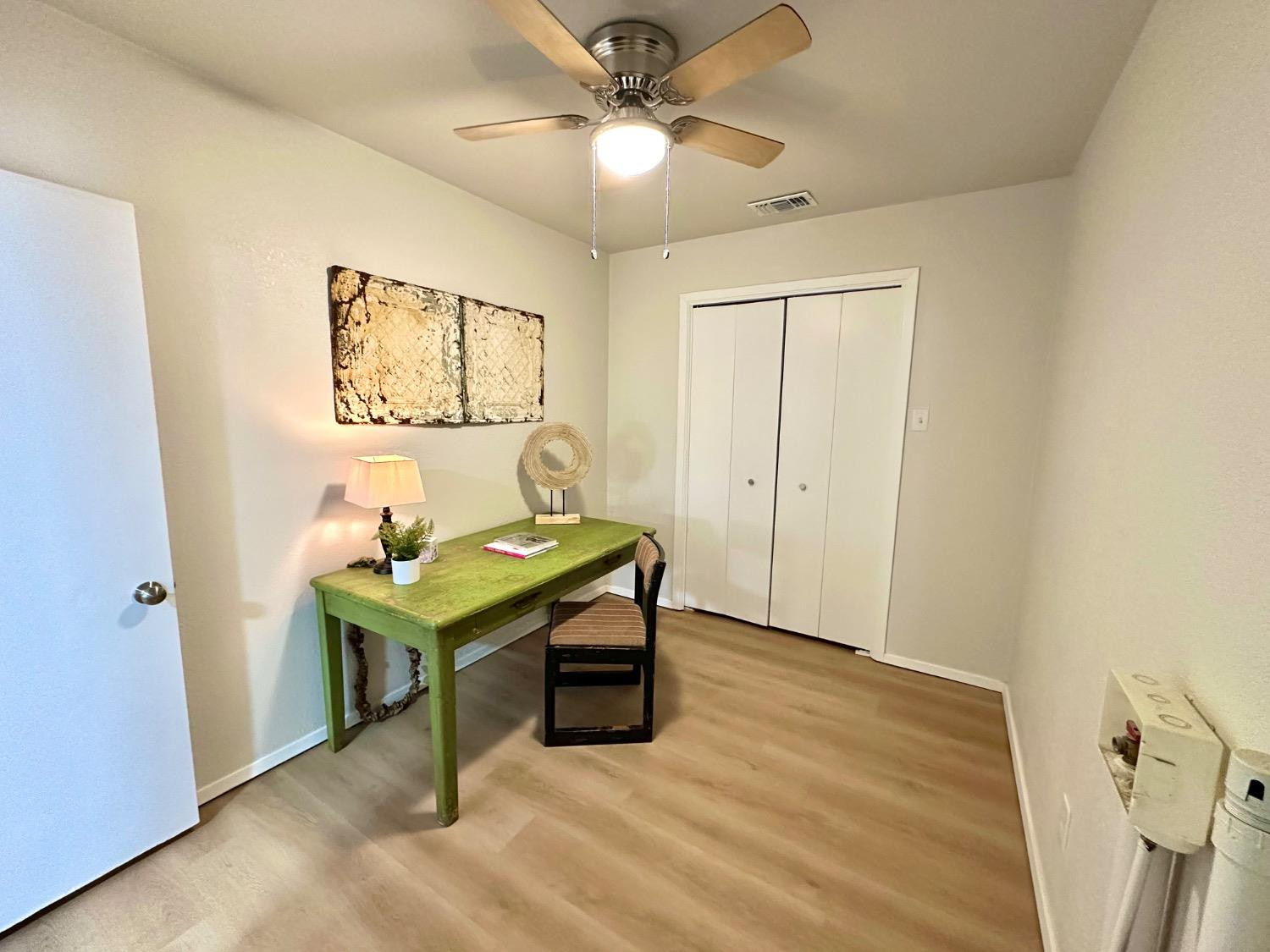 101 15th Street Levelland, TX 79336 - Photo 24 of 29 a view of a room with furniture and wooden floor